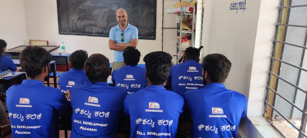 Trainees in Skill Development Program T-shirts attending a classroom talk