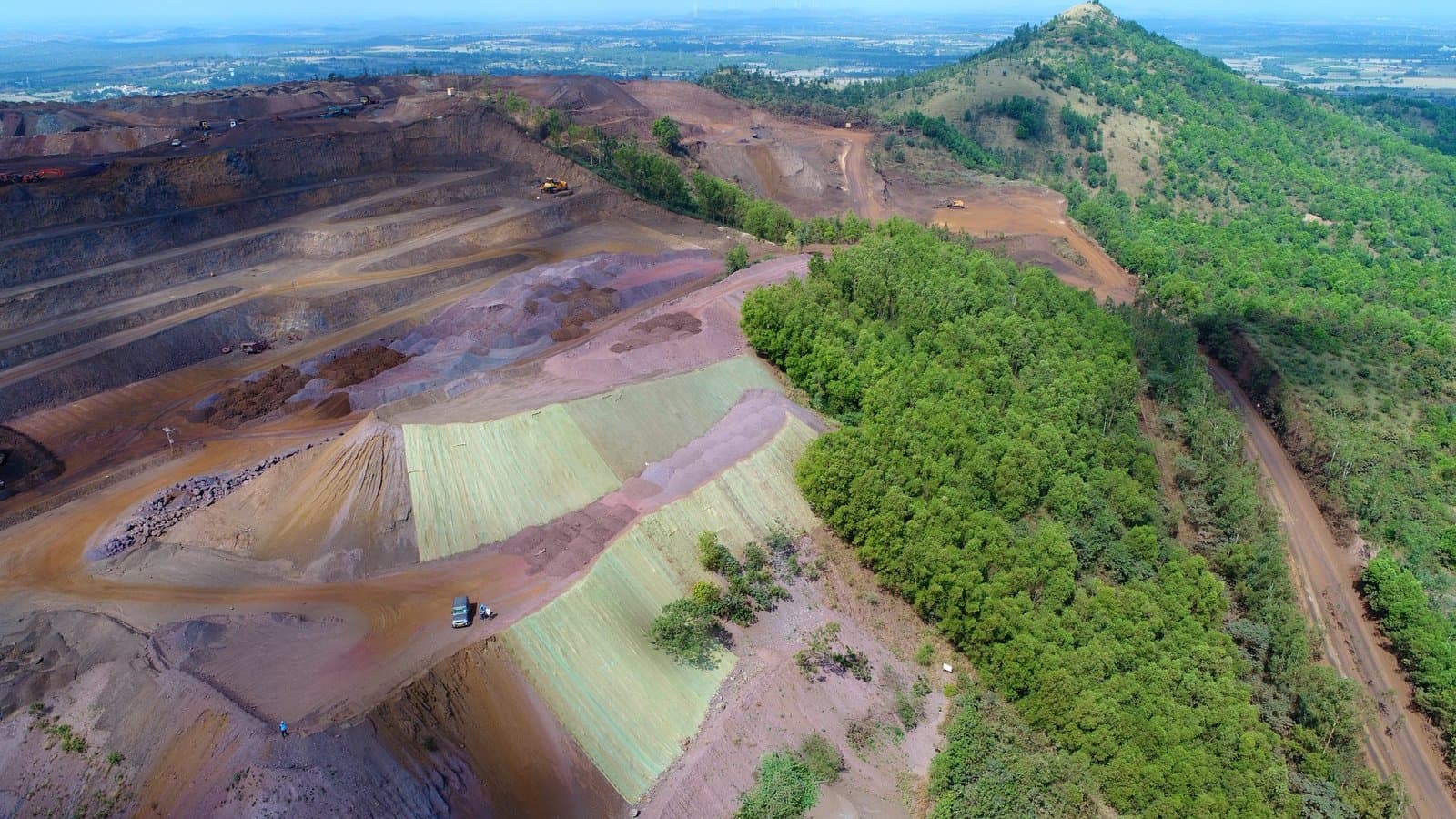 Stabilised and vegetated waste dump at John Mine